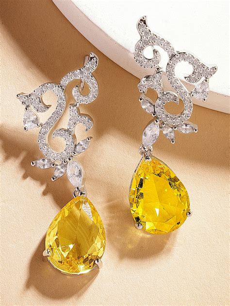 Karatcart Silver Plated Floral Shape Yellow American Diamond Studs for