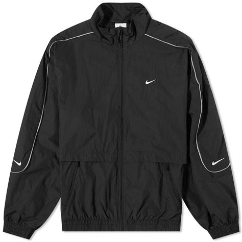 Nike Men's Solo Swoosh Woven Track Jacket in Black/White Nike