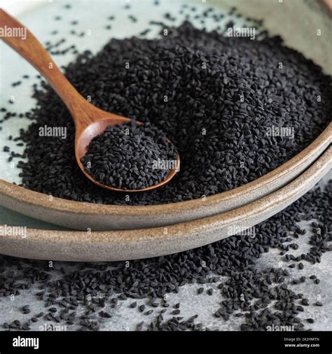 Plate of Indian spice Black cumin (nigella sativa or kalonji) seeds ...