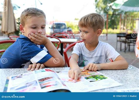 Two Brothers with Menu in Restaurant Stock Image - Image of lunch, meal ...