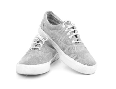 Premium Photo | Pair of grey tennis shoes isolated on white