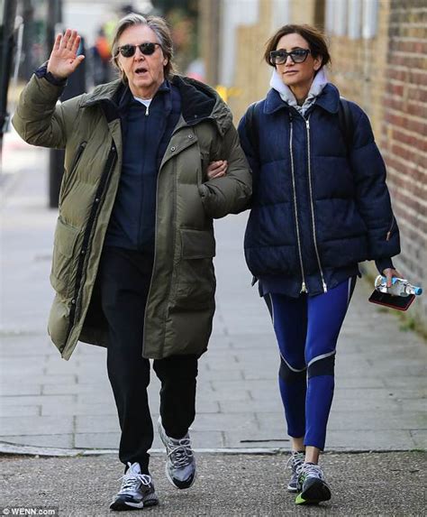 The Beatles' Sir Paul McCartney is arm in arm with wife Nancy Shevell ...