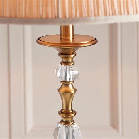 Polina antique brass floor light teamed with a beige organza effect shade