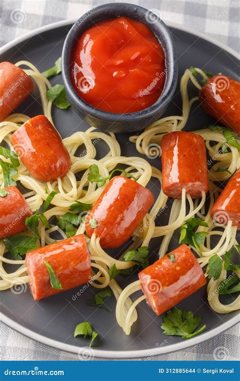 Delicious Spaghetti Hot Dog in the Form of Spiders and Ketchup Close-up ...