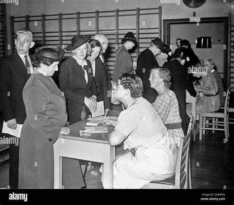 1940. Rationing during World War II. Here registration for ration cards at the ration office in ...