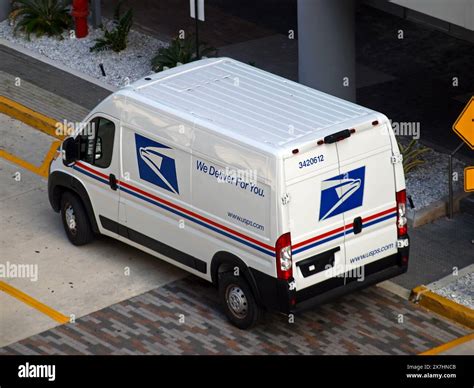 U.S. Postal Service (USPS) trucks are parked at a post office on August 23, 2024 in Glendale, Califo