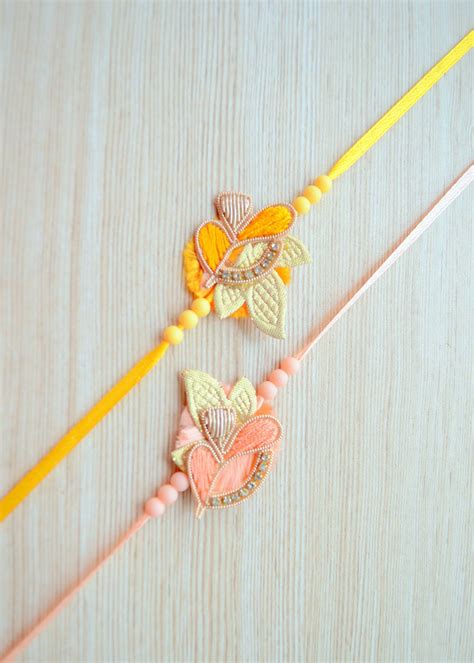 Get Yellow, Peach And White Artisanal Leaf Rakhi - Set of 2 at ₹ 419 ...