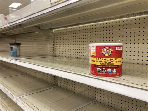 A baby formula display sits nearly empty at a Target store in Orlando.