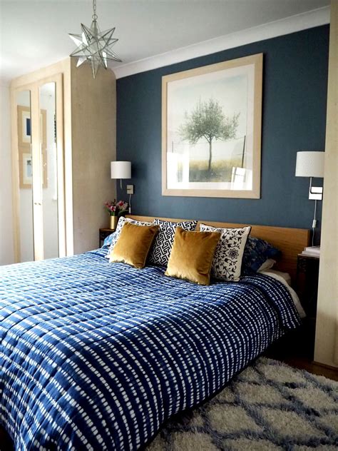 Bedroom styling ideas - dark blue wall and blue accents. Ikea MALM bed ...