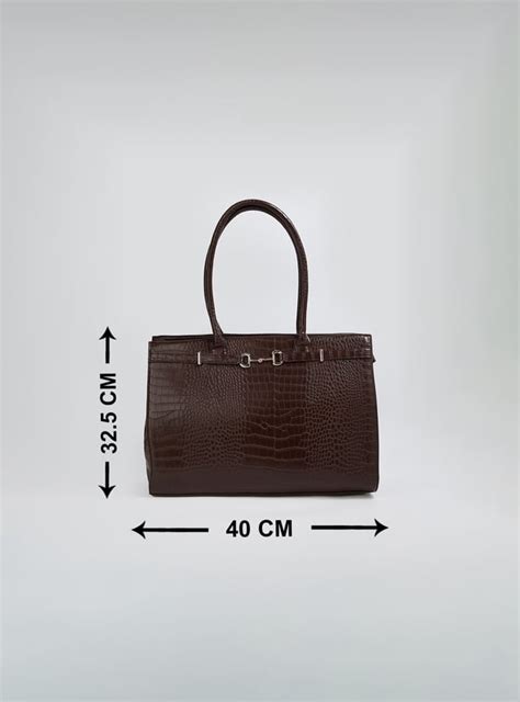 Buy Women Textured Shoulder Bag Online at just Rs. 1299.0 ...