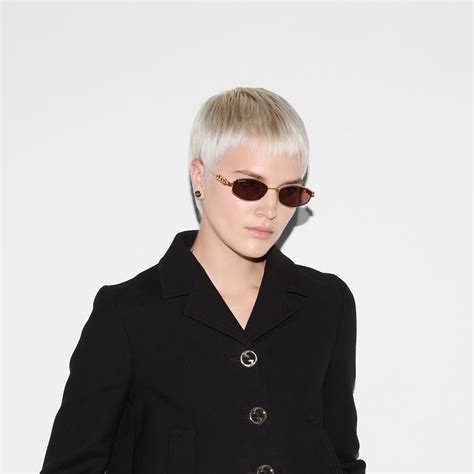 Oval frame sunglasses in gold-toned | GUCCI® US