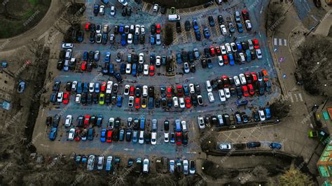 Premium Photo | Aerial view of a crowded parking lot with various cars ...