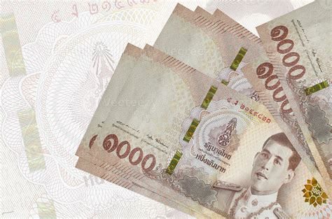 1000 Thai baht bills lies in stack on background of big semi ...