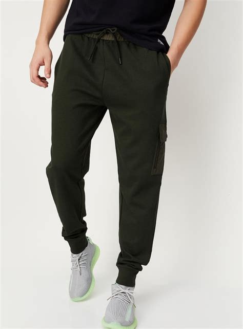 Buy Men Solid Athleisure Cargo Joggers Online at just Rs. 1299.0 ...