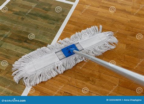 Cleaning Mop On Wooden Floor With Court Lines In Gymnasium Or Sports ...