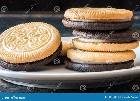 Chocolate and Vanilla Sandwich Cookies Stock Image - Image of plate ...
