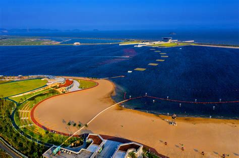 宁波北仑区梅山湾沙滩公园滨海沙滩4K航拍mp44K视频素材
