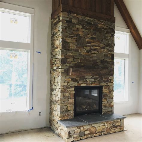 Floor-to-Ceiling Stacked Stone Fireplace