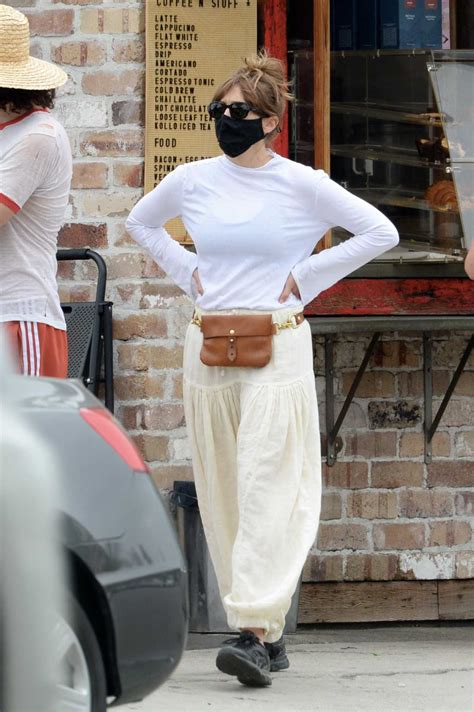Elizabeth Olsen in a White Long Sleeves T-Shirt Picks Up Coffee Out ...