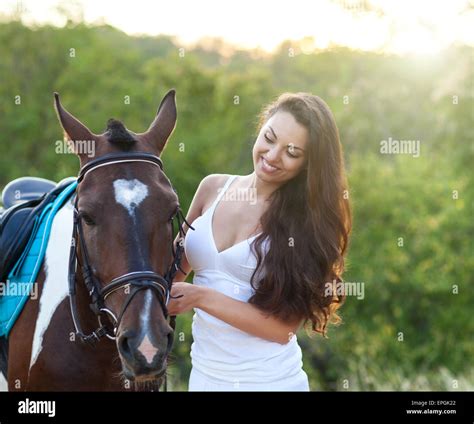 Beautiful woman and a horse Stock Photo - Alamy