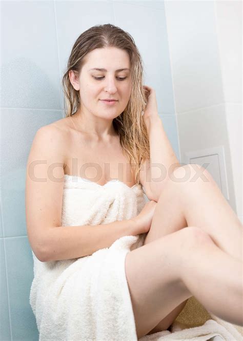 Two woman wearing EDITION bath robes and towels wrapping their hair