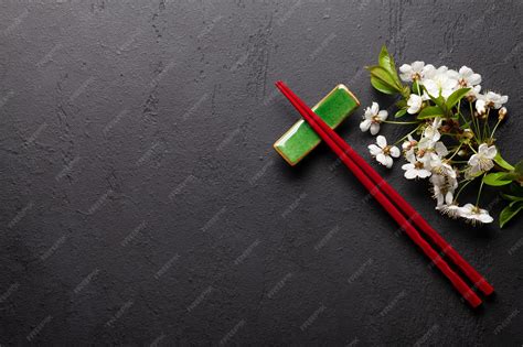 Premium Photo | Japanese food with cherry blossom and sushi chopsticks