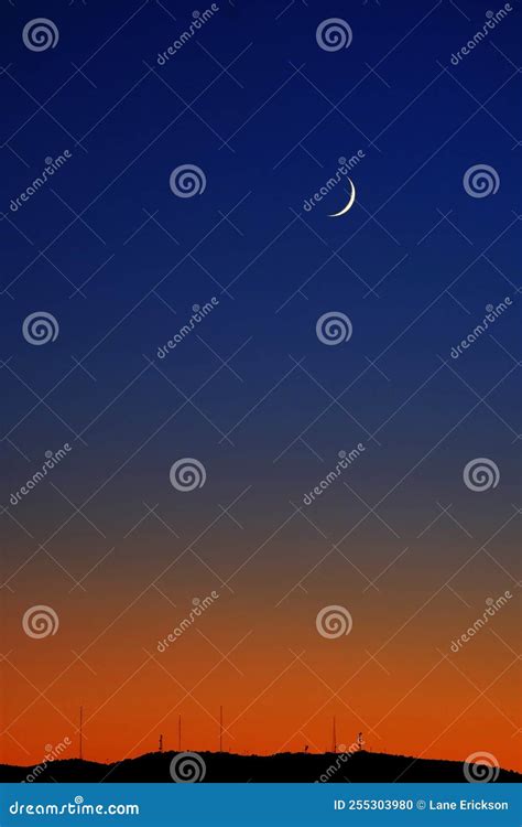 Cresent Moon on Horizon at Twilight Orange Glow Sunset Radio Towers ...