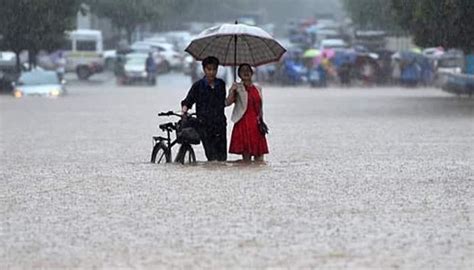 China issues blue alert for rainstorms - IBTimes India
