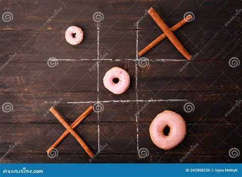 Tic Tac Toe Game with Different Sized Donuts and Cinnamon Sticks on ...