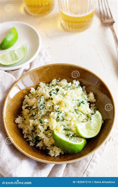 Cauliflower Low-carb Rice or Couscous with Chopped Cilantro and Lime in ...
