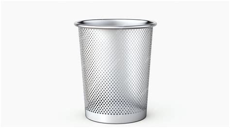 Premium Photo | A silver trash can with a perforated surface