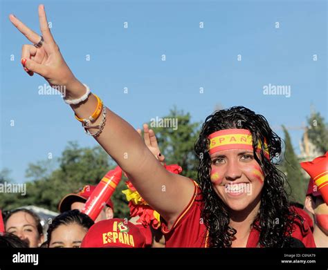 Crowds cheer for the Spanish team as they travel in an open bus as part ...