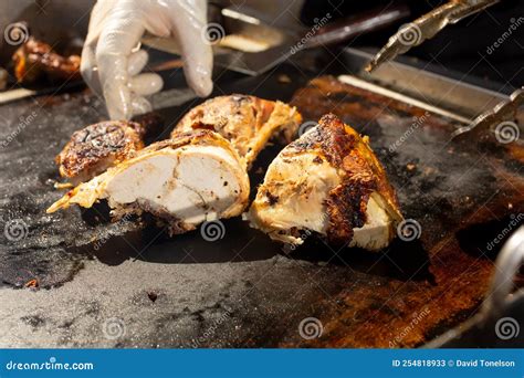 Pollo asado, hand, tongs stock image. Image of beef - 254818933