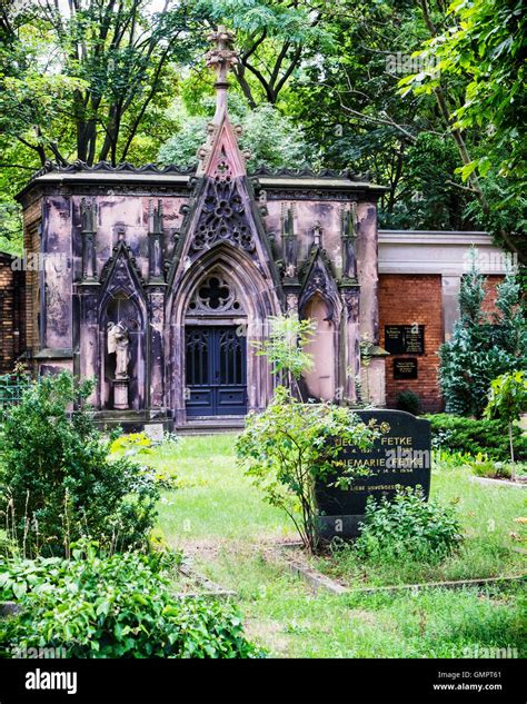 Old weathered repaired tomb and shiny modern grave stone at the St ...