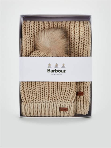 the barbour beanie and mitt set in beige is packaged in a cardboard box