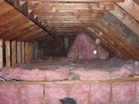 Home Pride Contracting: Installing plywood in an attic