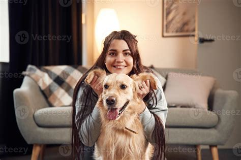 Playing ,with ,ears, front view, portrait. Woman, is with golden ...