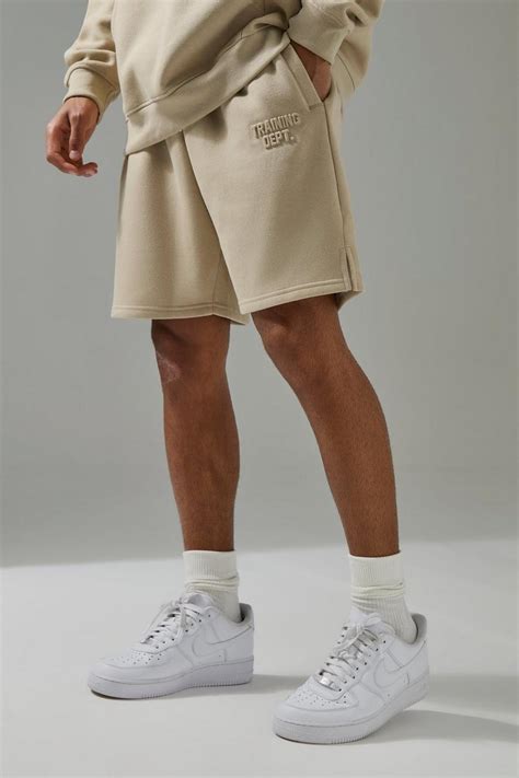 Man Active Training Dept Oversized 7inch Embossed Shorts | boohoo UK
