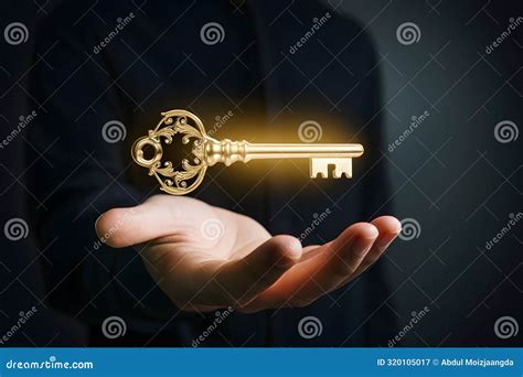 Mysterious Hand Holding Glowing Golden Key in Dark with Intricate ...