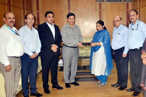 J&K Bank CMD hands over claim cheques to kin of the deceased employee ...