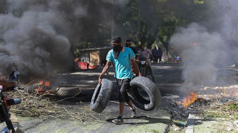 Vigilantes chop up mobsters & burn bodies in 'world's most dangerous city' after Haiti warlord ...