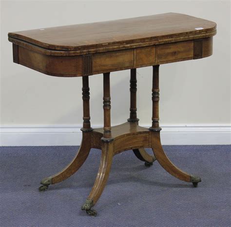 A George IV mahogany rectangular card table, the top crossbanded and ...