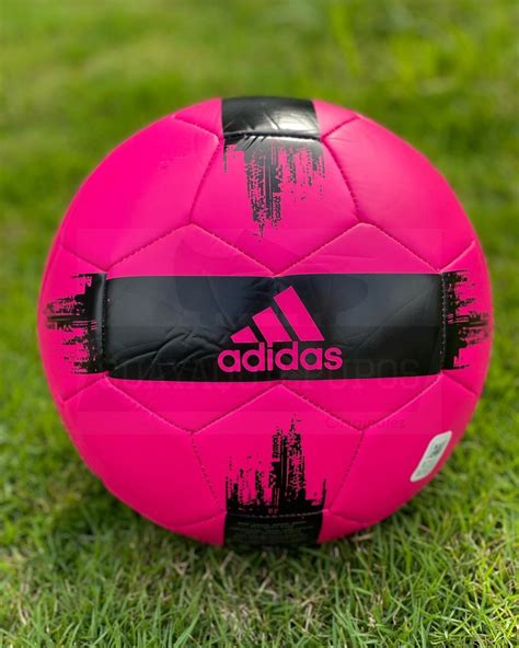 Adidas Pink Soccer Ball on Green Grass Field