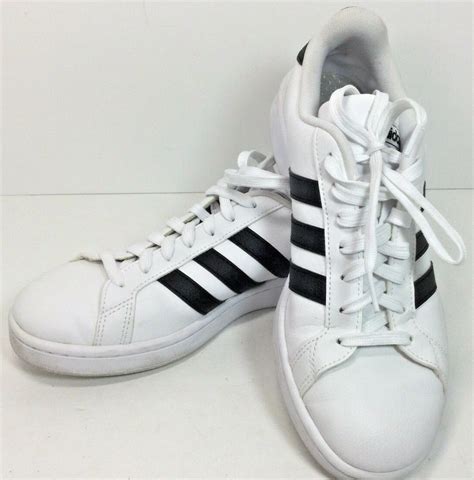 Adidas white shoes with black stripes online