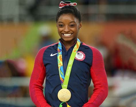 How tall is Simone Biles? | Britannica