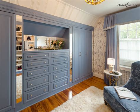 Sporting Blue built-in drawers & cabinets w/ mirrored inserts create a ...