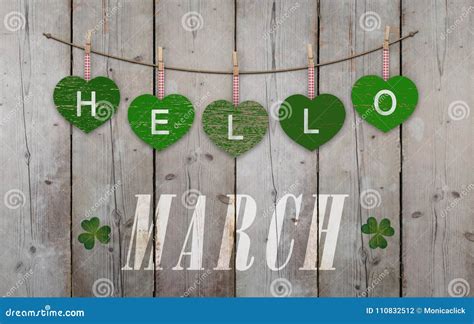 Hello March Written on Hanging Green Hearts and Weathered Wooden ...
