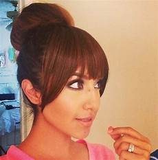Donut Hairstyles With Bangs by Donut Bun With Bangs Weaves Sew Ins And Relaxed Donut Hairstyles With Bangs