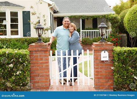 Senior Hispanic Couple Standing Outside Home Stock Photo - Image of ...