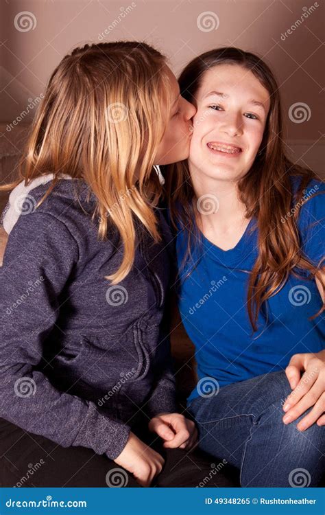 Sisters kissing stock image. Image of sisters, braces - 49348265